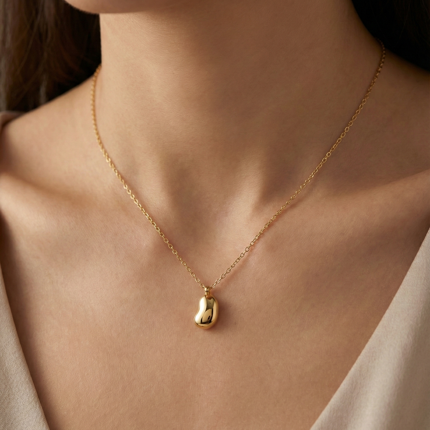 Collier haricot doré en acier inoxydable