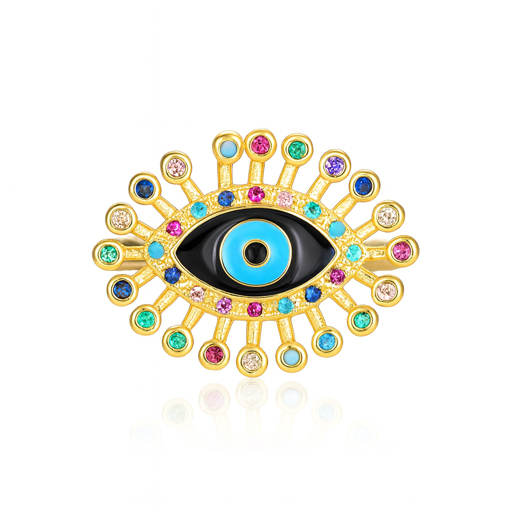 cette bague œil protecteur dorée en acier inoxydable ornée de strass multicolores scintillants. Le motif central en forme d’œil grec ou œil de Nazar incarne la protection contre le mauvais œil, tout en apportant une touche ultra tendance à vos tenues.