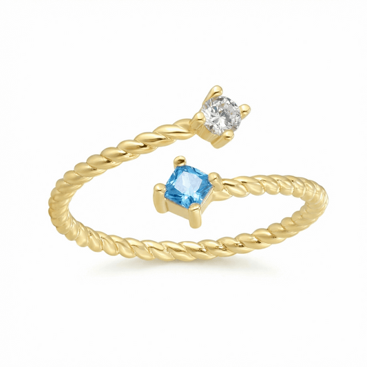 Bague dorée à l’or 18k torsadée, sertie de deux pierres blanche et bleue, design ouvert, élégante pour un usage quotidien