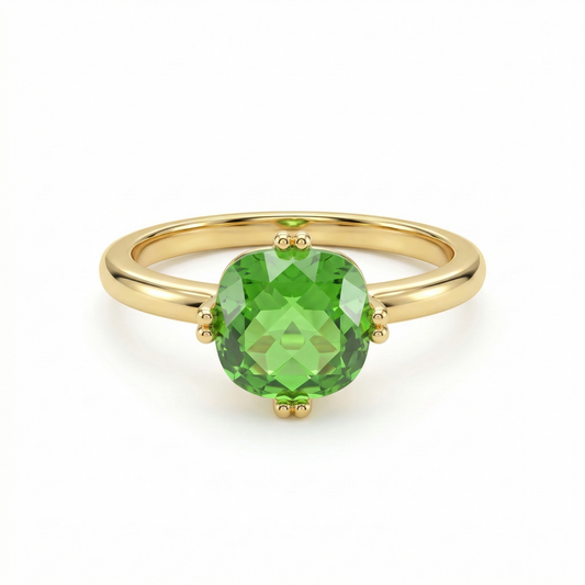 Bague dorée en acier inoxydable avec pierre verte facettée sertie à quatre griffes
