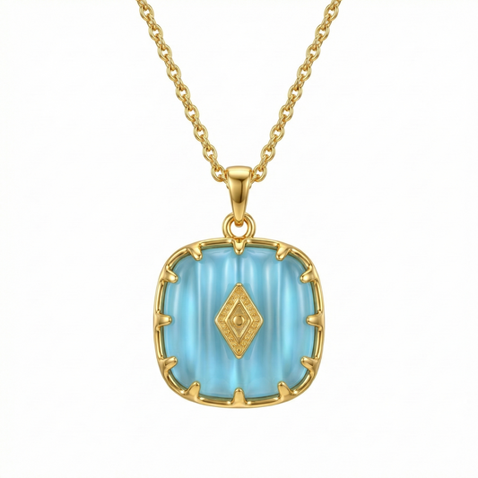 Collier doré en acier inoxydable avec pendentif turquoise serti et détails dorés