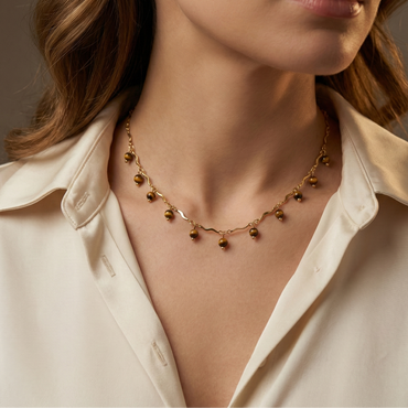 Collier doré en acier inoxydable avec chaîne ondulée et perles marron bohème chic