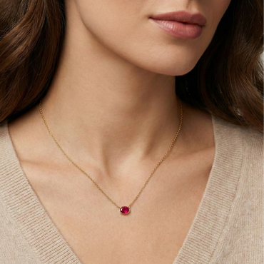 Collier fin doré or 18k avec pierre rouge ovale facettée sur chaîne torsadée