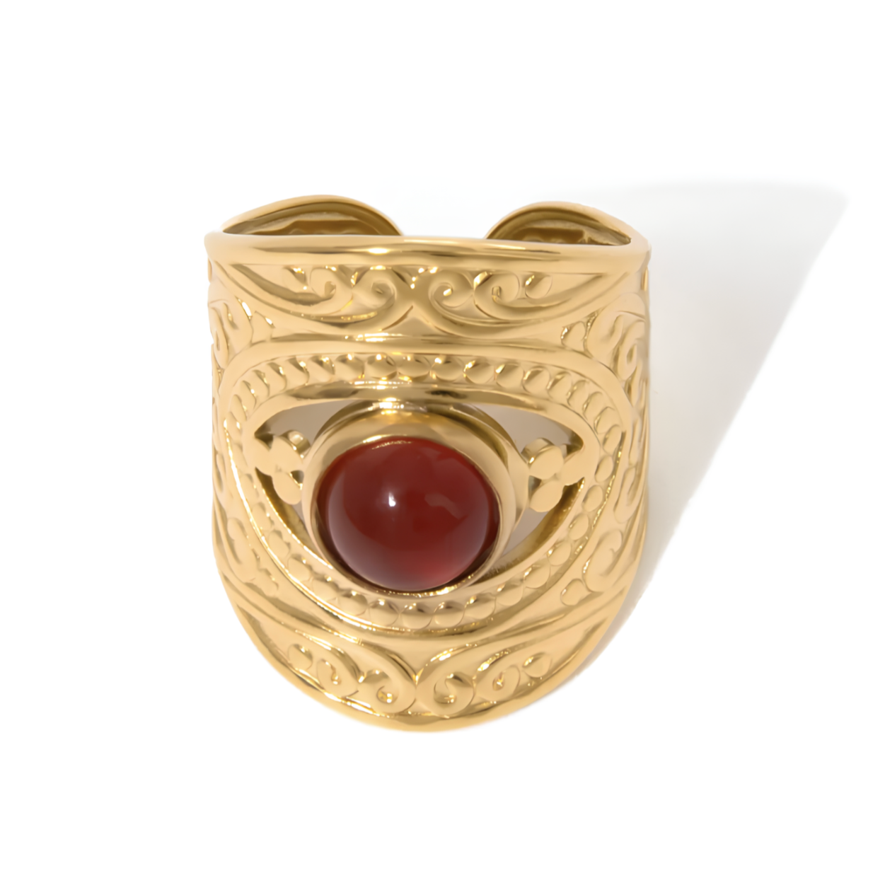 Ajoutez une note de caractère à votre style avec cette bague manchette en acier inoxydable doré, sublimée par une agate rouge intense. Sa structure large, gravée de motifs délicats, lui confère une allure à la fois bohème et affirmée, parfaite pour rehausser vos tenues avec originalité.