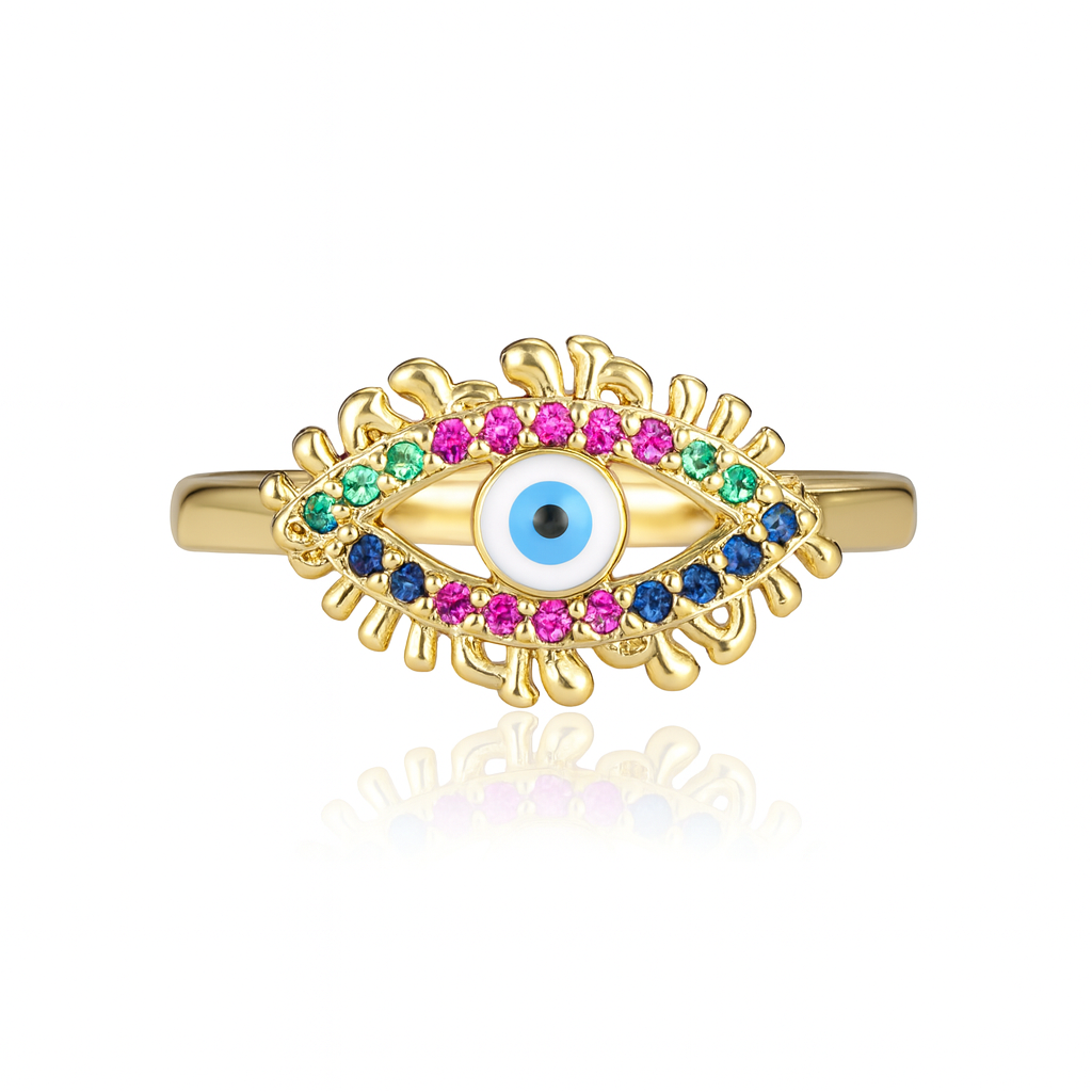 cette bague dorée œil protecteur, où un pupille émaillée bleue intense est encadrée de strass multicolores étincelants. Avec ses détails sculptés en forme de cils, elle mêle symbolisme spirituel et design moderne, pour un effet à la fois ludique et protecteur.