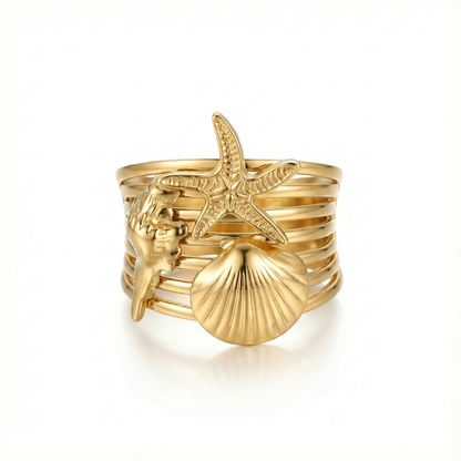 Bague large multi-rangs illusion accumulation : motifs étoile de mer et coquillages en acier inoxydable doré.