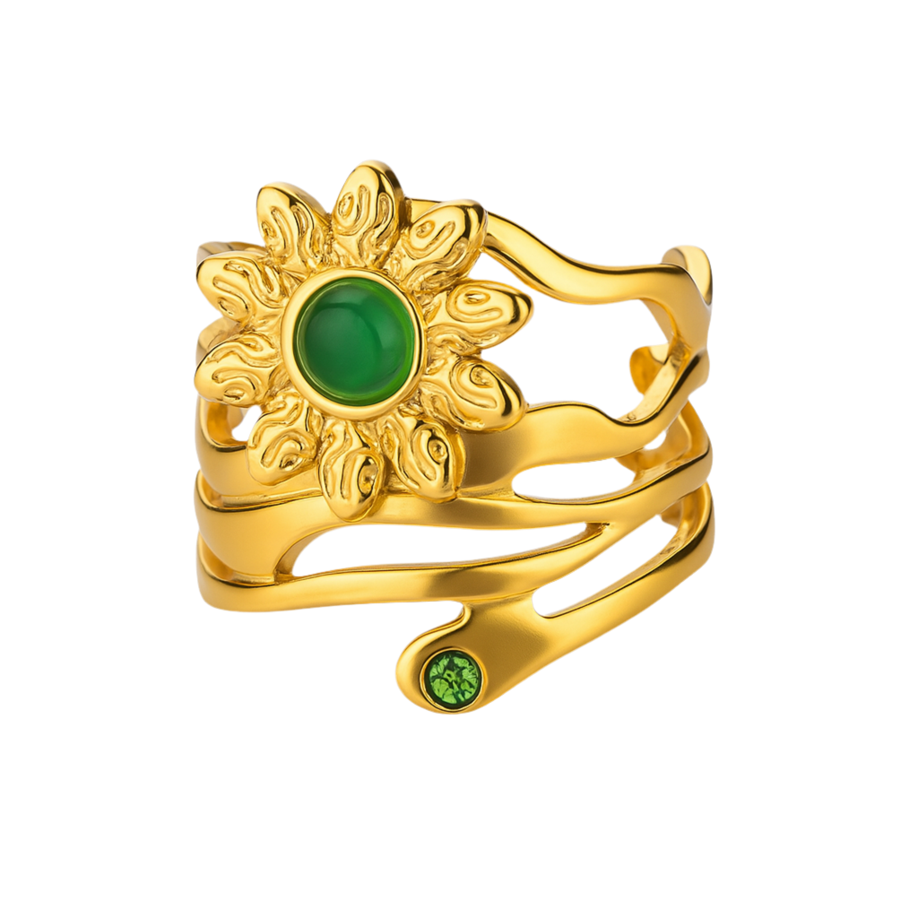 Inspirée des forces de la nature, cette bague dorée au motif de fleur solaire mêle énergie végétale et éclat doré dans un design fluide et vibrant. Au cœur de la fleur, une pierre verte lisse capte la lumière avec douceur, renforçant l’aspect solaire et symbolique du bijou.