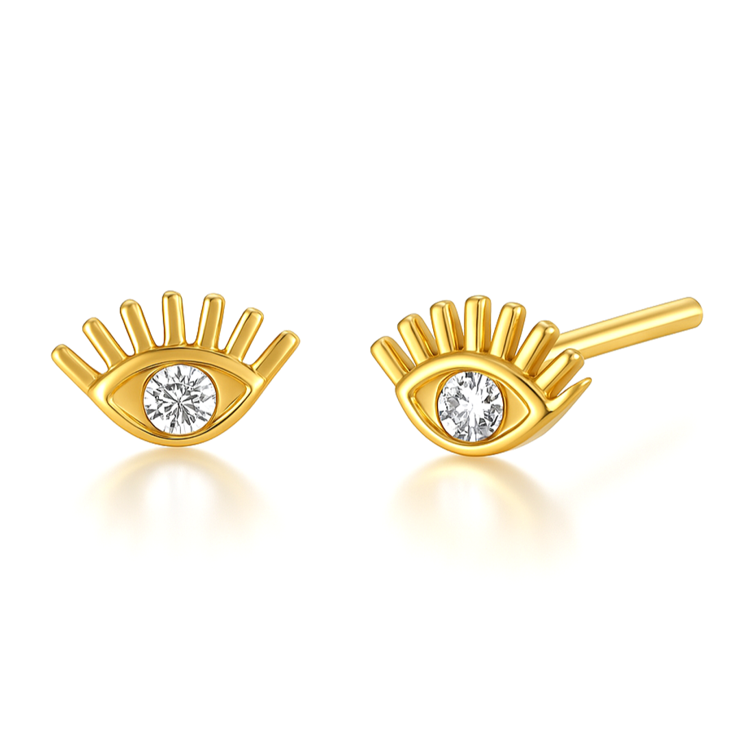 Ajoutez une touche de mystère et de protection à votre look avec ces boucles d'oreilles puces en argent 925 doré à l'or fin, ornées d’un œil symbolique et d’un zircon scintillant. L'œil, symbole de protection et de sagesse, et se distingue par son éclat subtil. Le doré à l'or fin de l'argent 925 confère une brillance chaude et intemporelle, sublimant l’élégance et la profondeur du design.