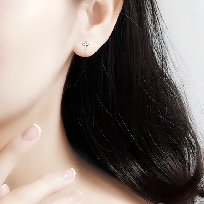 Apportez une touche de chic discret et de spiritualité à votre look avec ces boucles d'oreilles puces en argent fin 999, ornées de petites croix délicates. Leur design épuré et élégant fait de ces puces un bijou intemporel, parfait pour ajouter une touche de modernité et de raffinement à votre style au quotidien. Idéales pour celles qui cherchent à combiner simplicité et élégance avec une touche de signification.