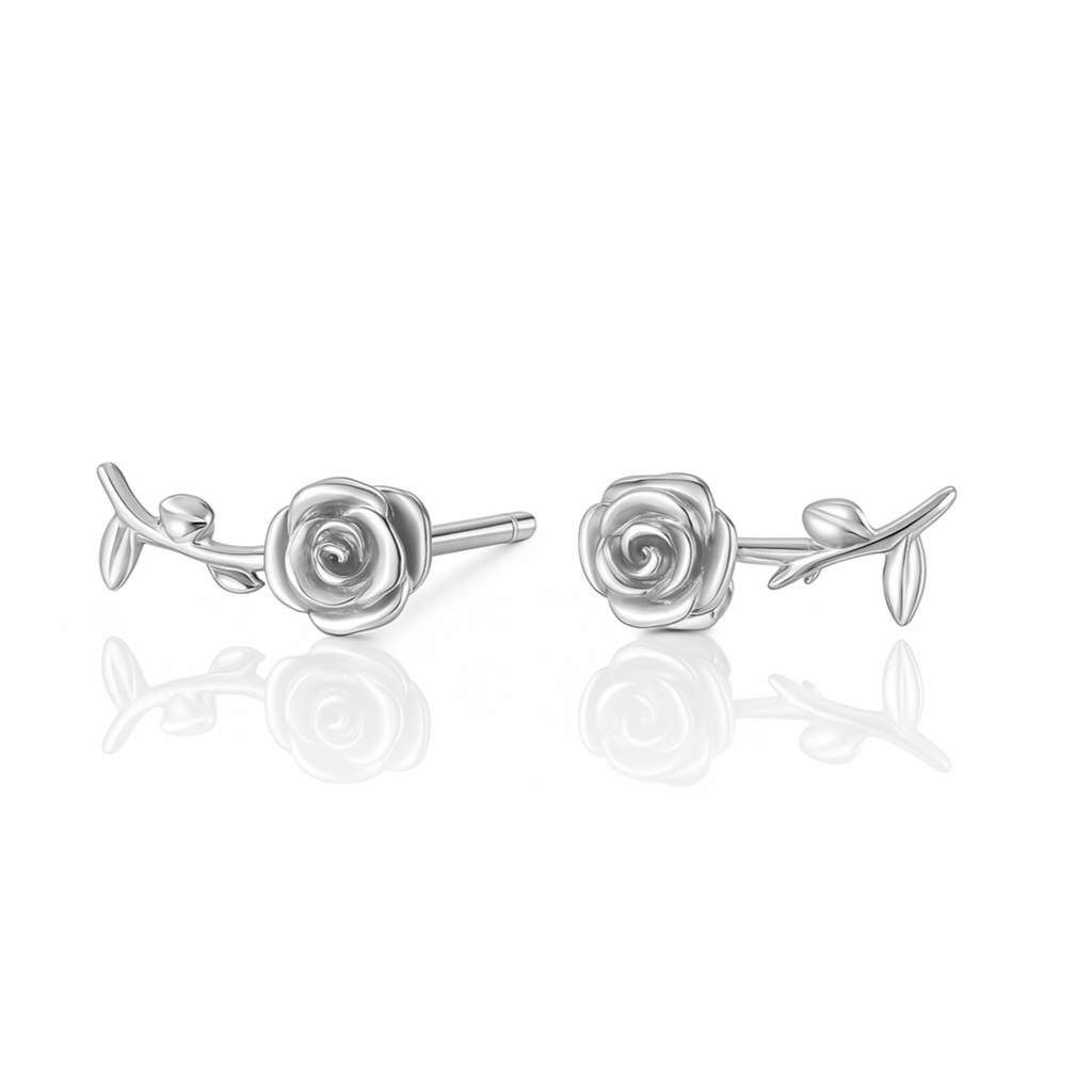 Apportez une touche de fraîcheur et de poésie à votre look avec ces boucles d'oreilles puces en argent 925, ornées d’une rose délicate, de pétales et de feuilles finement travaillées. Le design florale élégant et raffiné apporte une touche de douceur et de naturel, tandis que l'argent 925 assure une brillance durable et intemporelle. Ces boucles d'oreilles, parfaites pour ajouter une touche de féminité à vos tenues.