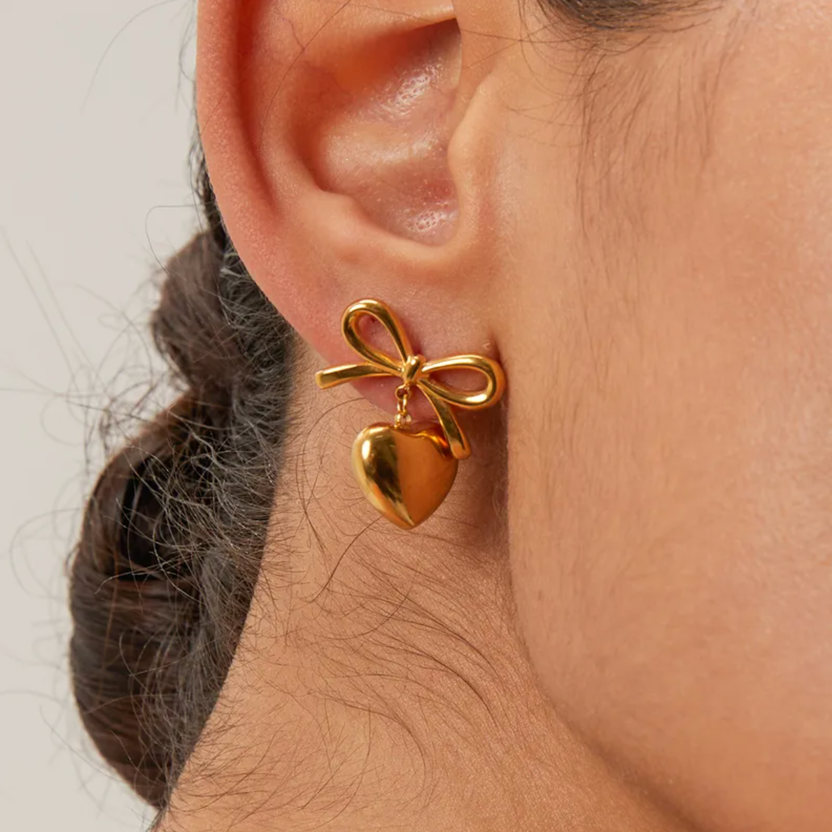 Boucles d'Oreilles Pendantes Acier Inoxydable Doré Cœur et Nœud