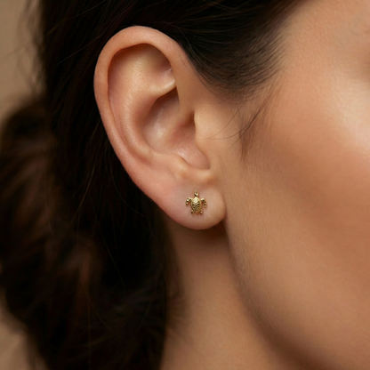 Boucles d’oreilles tortue stylisée en acier inoxydable doré