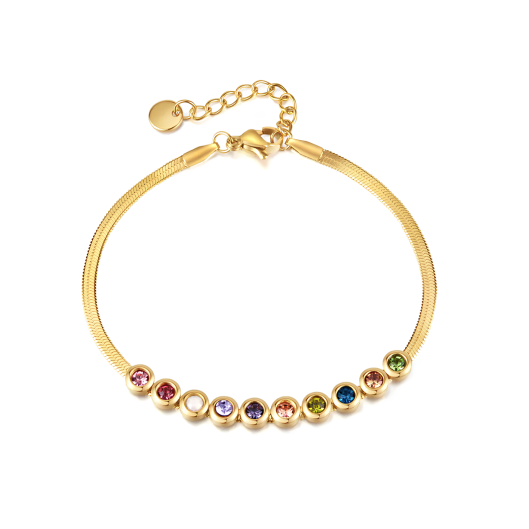 Ce bracelet en acier inoxydable doré, orné de cristaux multicolores sertis dans une rangée harmonieuse, apporte une touche lumineuse, joyeuse et raffinée à votre poignet. Un bijou plein de peps, à la fois minimaliste et expressif.

Matériau : Acier inoxydable couleur doré, placage PVD or 18K, cristaux synthétiques colorés, hypoallergénique, résistant à l’eau et à l’oxydation.

Dimensions : Longueur ajustable avec chaîne d’extension – poids léger – fermoir mousqueton sécurisé.

Design : 9 cristaux ronds sert