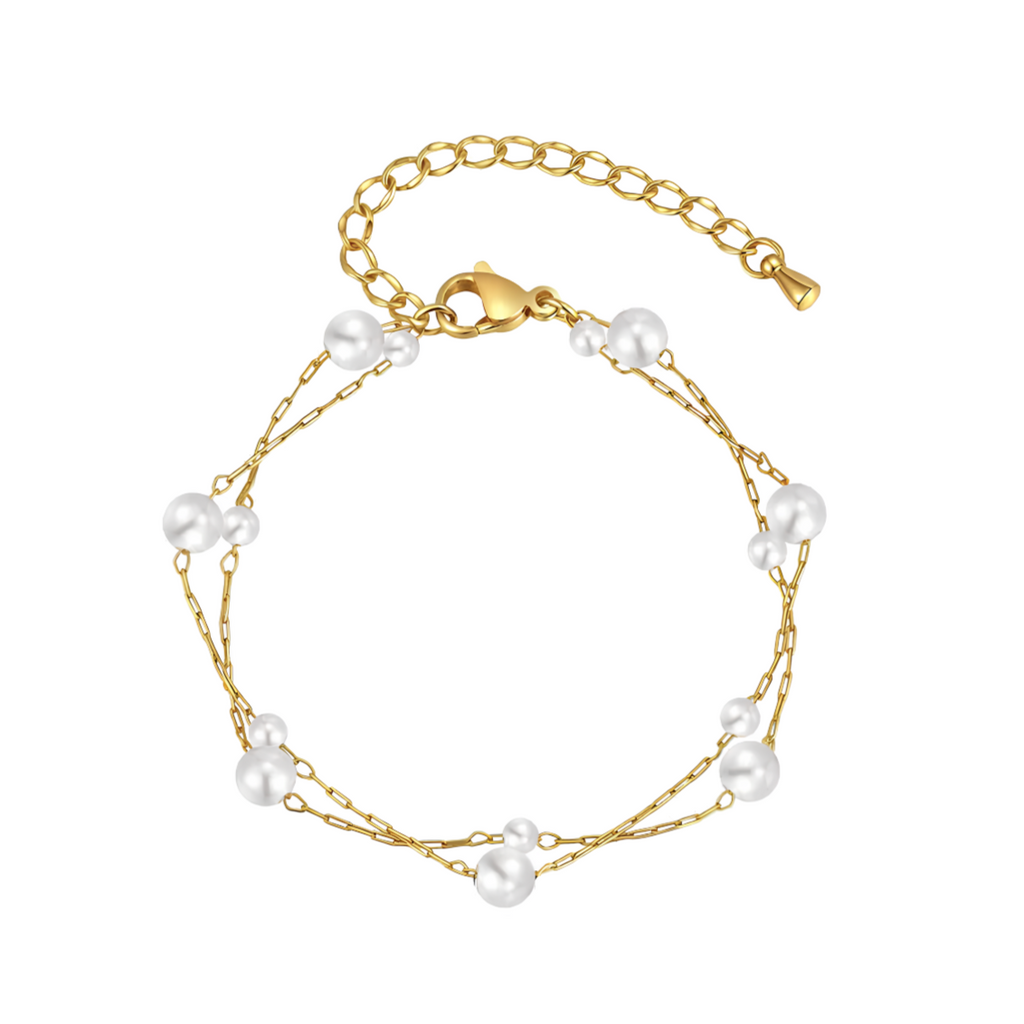 Ce bracelet double rang allie une chaîne dorée délicate à des perles blanches de tailles variées pour un effet sophistiqué et aérien. Léger et féminin, il s’adapte à toutes les tenues, du quotidien aux occasions spéciales.

Matériaux : Acier inoxydable et perles synthétiques, finition couleur or
Dimensions : 16 + 5 cm – diamètre perle max : 0,5 cm – poids : 2 g
Style : Minimaliste, élégant, féminin