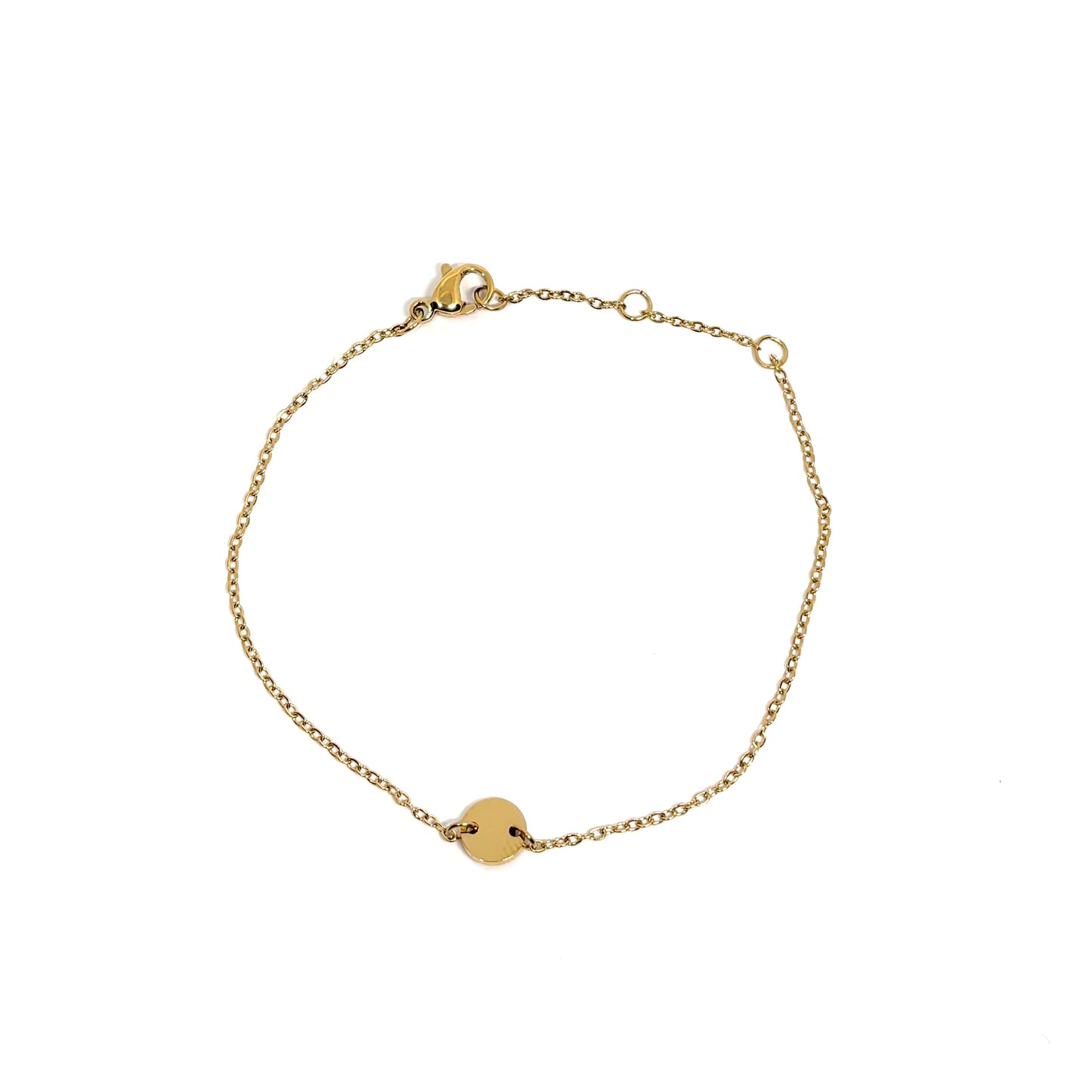 Bracelet femme en acier inoxydable couleur doré, orné d’un disque central lisse sur une chaîne fine. Bijou minimaliste, ajustable, hypoallergénique et résistant à l’eau, parfait pour un look raffiné et lumineux au quotidien.