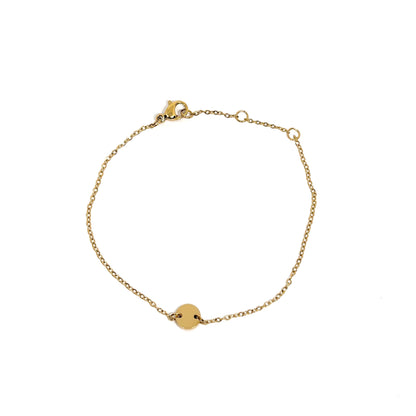 Bracelet femme en acier inoxydable couleur doré, orné d’un disque central lisse sur une chaîne fine. Bijou minimaliste, ajustable, hypoallergénique et résistant à l’eau, parfait pour un look raffiné et lumineux au quotidien.