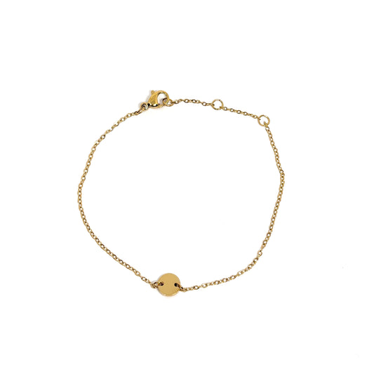 Bracelet femme en acier inoxydable couleur doré, orné d’un disque central lisse sur une chaîne fine. Bijou minimaliste, ajustable, hypoallergénique et résistant à l’eau, parfait pour un look raffiné et lumineux au quotidien.