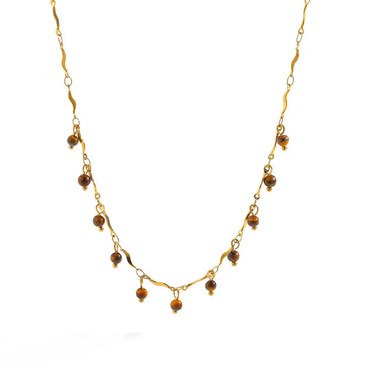 Collier couleur or en acier inoxydable avec petites perles marron pendantes, style bohème chic.