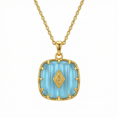 Collier doré en acier inoxydable avec pendentif turquoise serti et détails dorés