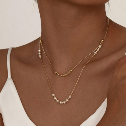 Collier double rang perles blanches et billes dorées en acier inoxydable