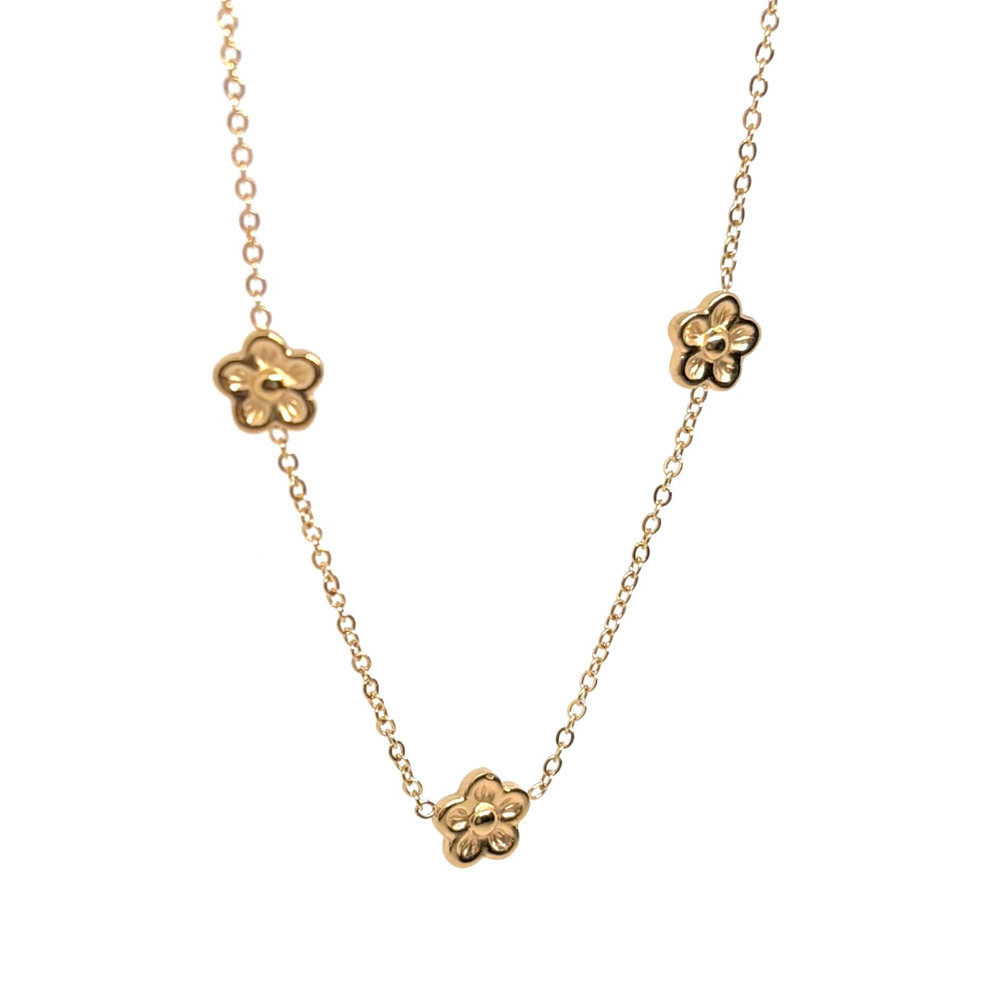 collier femme en acier inoxydable doré composé de trois fleurs miniatures en relief sur une chaîne fine, longueur 40 +5 cm, bijou floral délicat et bohème pour un look romantique et estival