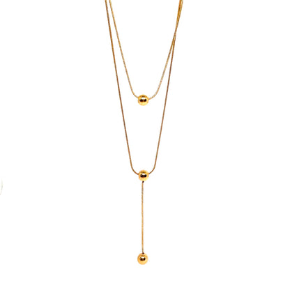collier femme double rang en acier inoxydable doré avec deux perles sphériques et pendentif vertical, longueur 38 et 45,5 +5 cm, bijou minimaliste et élégant au style contemporain
