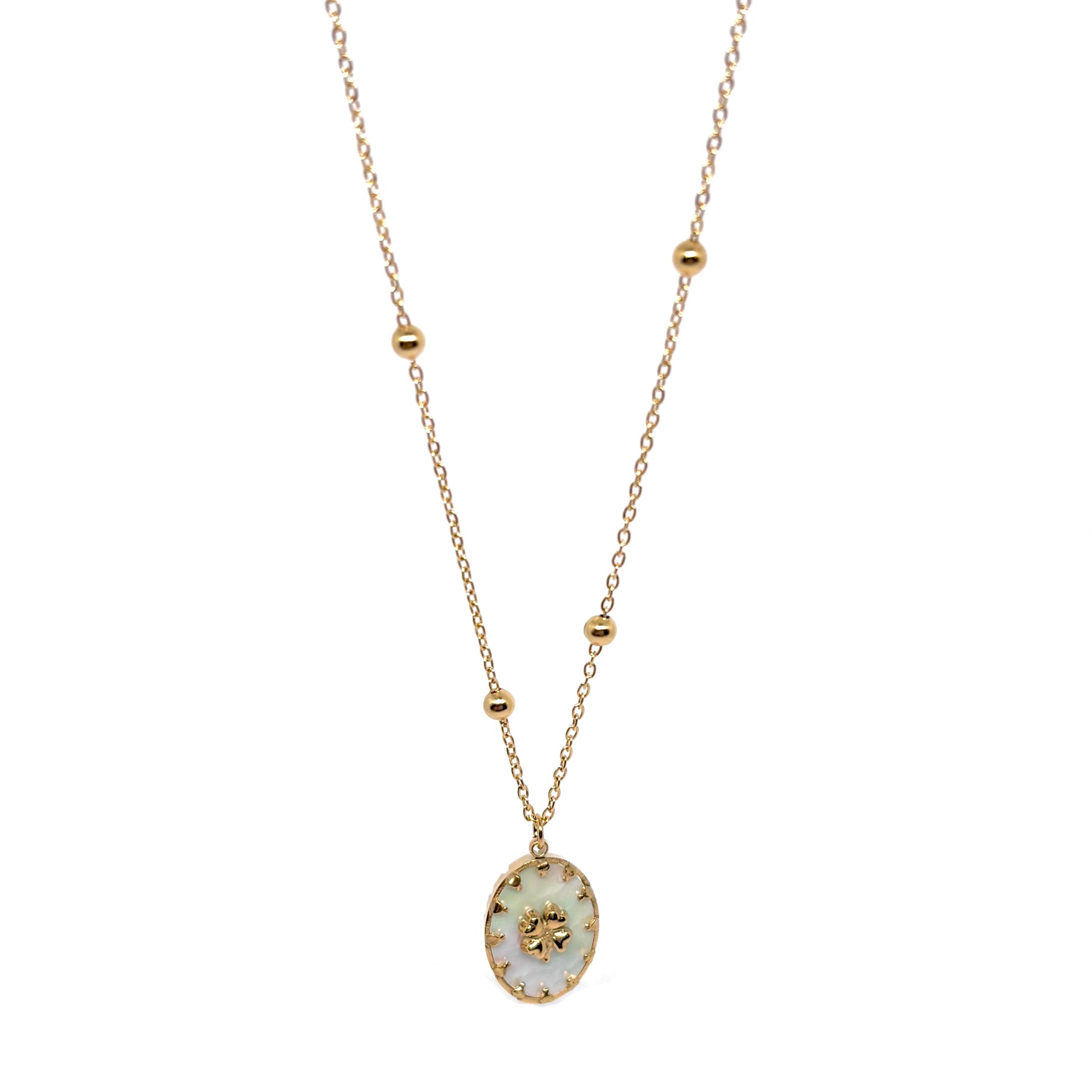 Collier double chaîne pour femme en acier inoxydable couleur doré, orné d’un médaillon en nacre naturelle avec étoile dorée à huit branches. Bijou lumineux et raffiné, résistant à l’eau et hypoallergénique, au style céleste et élégant