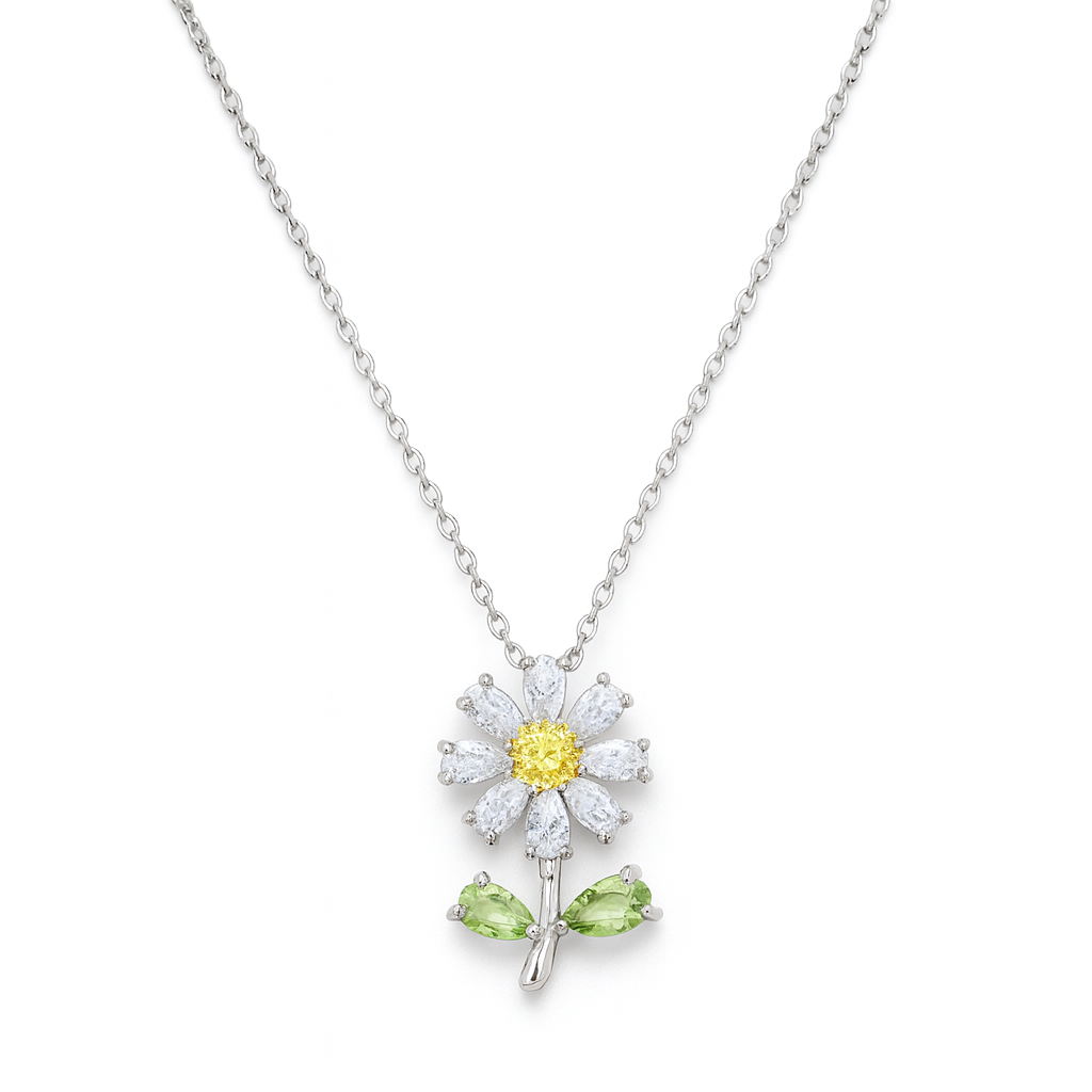 Ce collier marguerite en acier inoxydable couleur argent, serti de strass blancs, jaunes et verts, est une ode à la lumière, à la nature et à la fraîcheur florale. Un bijou joyeux et lumineux, parfait pour un style frais et pétillant.