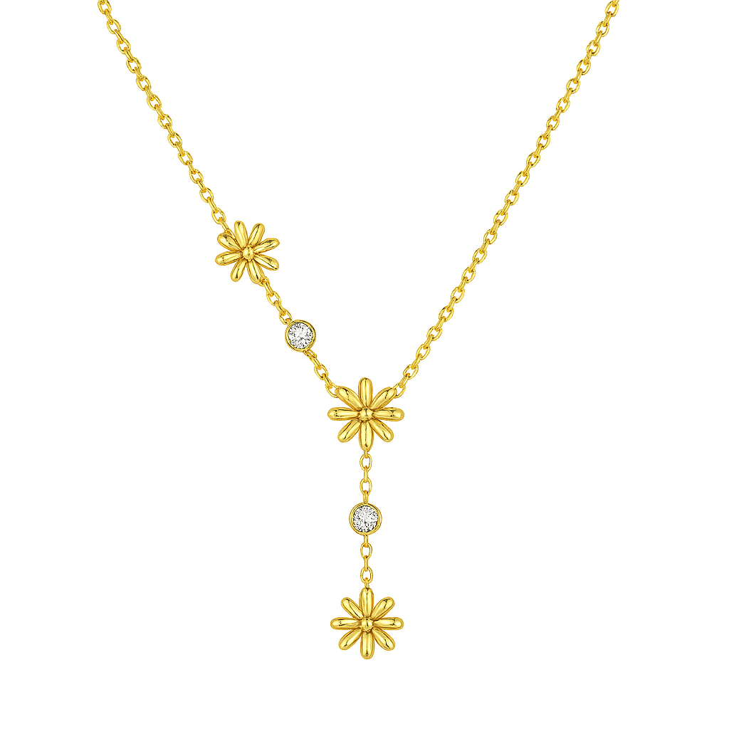 Un collier délicat et graphique, jouant sur une asymétrie florale et des cristaux étincelants. Parfait pour apporter une touche de lumière à un look sobre ou romantique.

Matériau : Acier inoxydable couleur doré, orné de cristaux transparents – résistant à l’eau, hypoallergénique.

Dimensions : Longueur ajustable 40 à 45 cm – pendentifs fleurs : 0,9 cm – poids léger : 4 g.

Design : Trois petites fleurs dorées disposées de façon décalée, reliées par une fine chaîne ponctuée de pierres brillantes. Un jeu de 