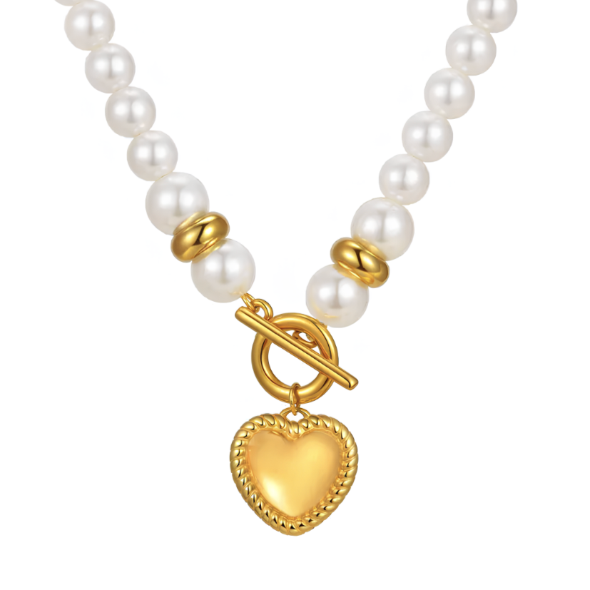 Un collier à la fois audacieux et romantique, où les perles blanches nacrées se marient à un pendentif cœur doré au style vintage. Le fermoir toggle apporte une touche mode assumée, placée volontairement à l’avant.

Matériau : Perles synthétiques nacrées, acier inoxydable couleur doré, fermoir résistant, hypoallergénique et sans risque de ternissure.

Dimensions : Longueur de 44 cm, diamètre des perles 0,8 cm, pendentif en forme de cœur bombé, poids 25 g pour un rendu affirmé sans excès.

Design : Alternanc